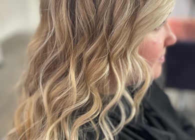Elegant blonde waves styled at Luxe Hair Beauty Aesthetics, Glasgow, Scotland, GB salon.