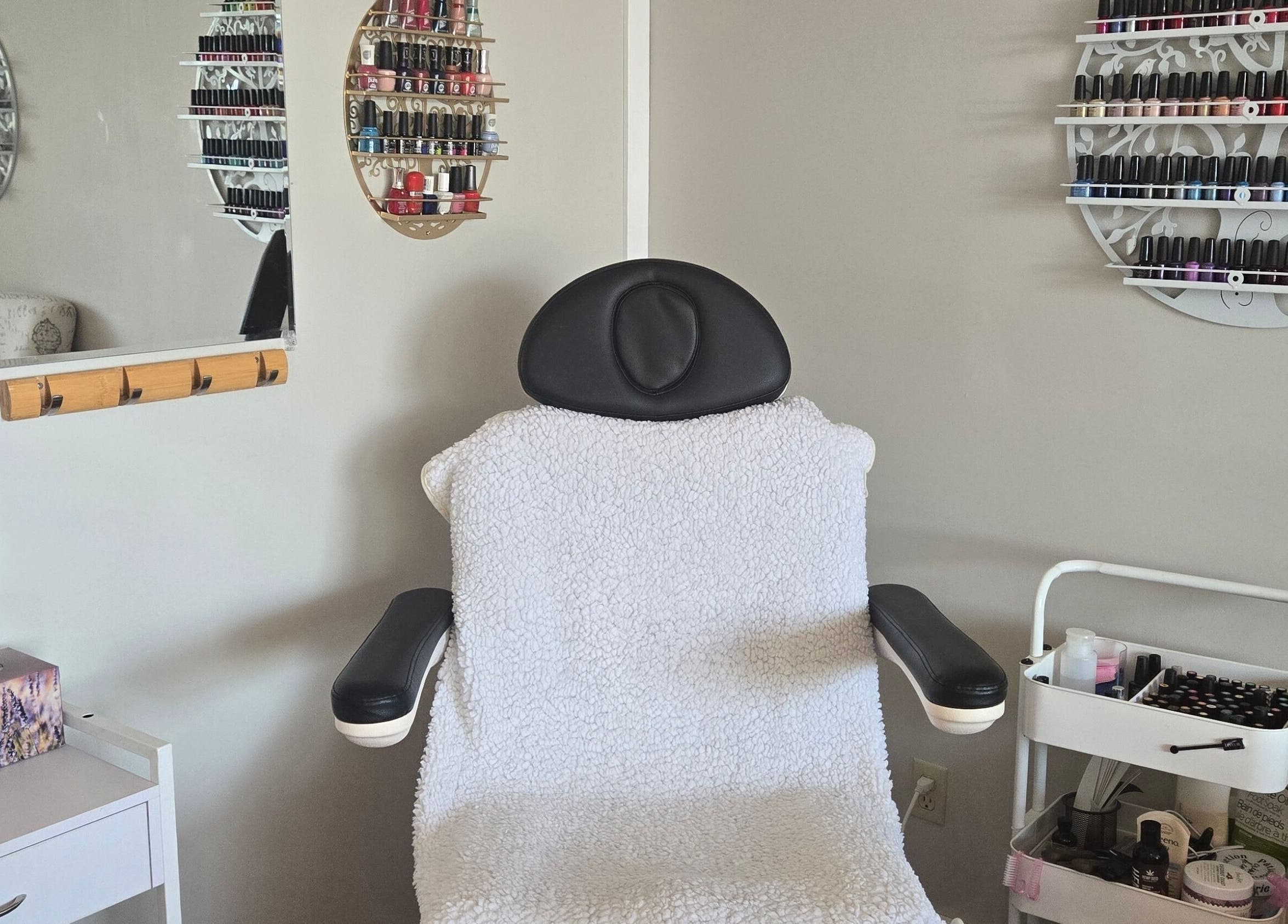 Comfortable spa chair with nail polishes at Tree Treat Spa, Kawartha Lakes, Ontario, CA.