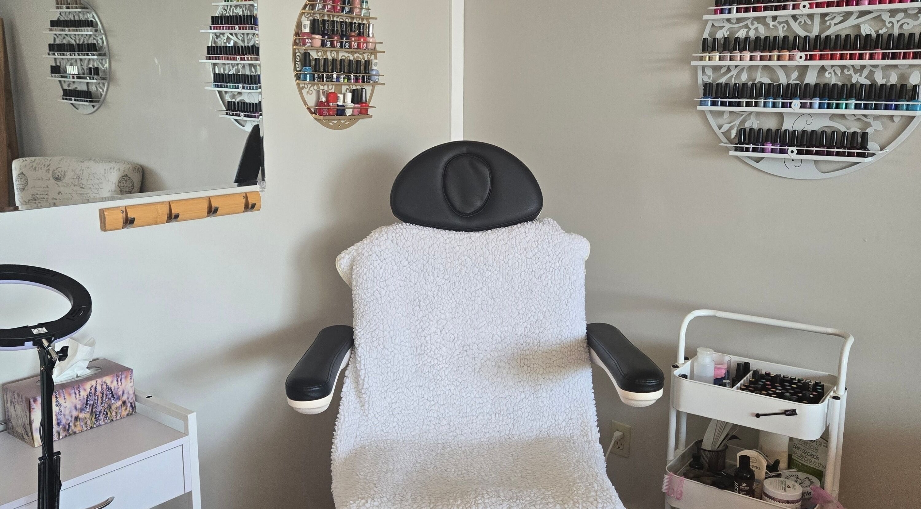 Comfortable spa chair with nail polishes at Tree Treat Spa, Kawartha Lakes, Ontario, CA.