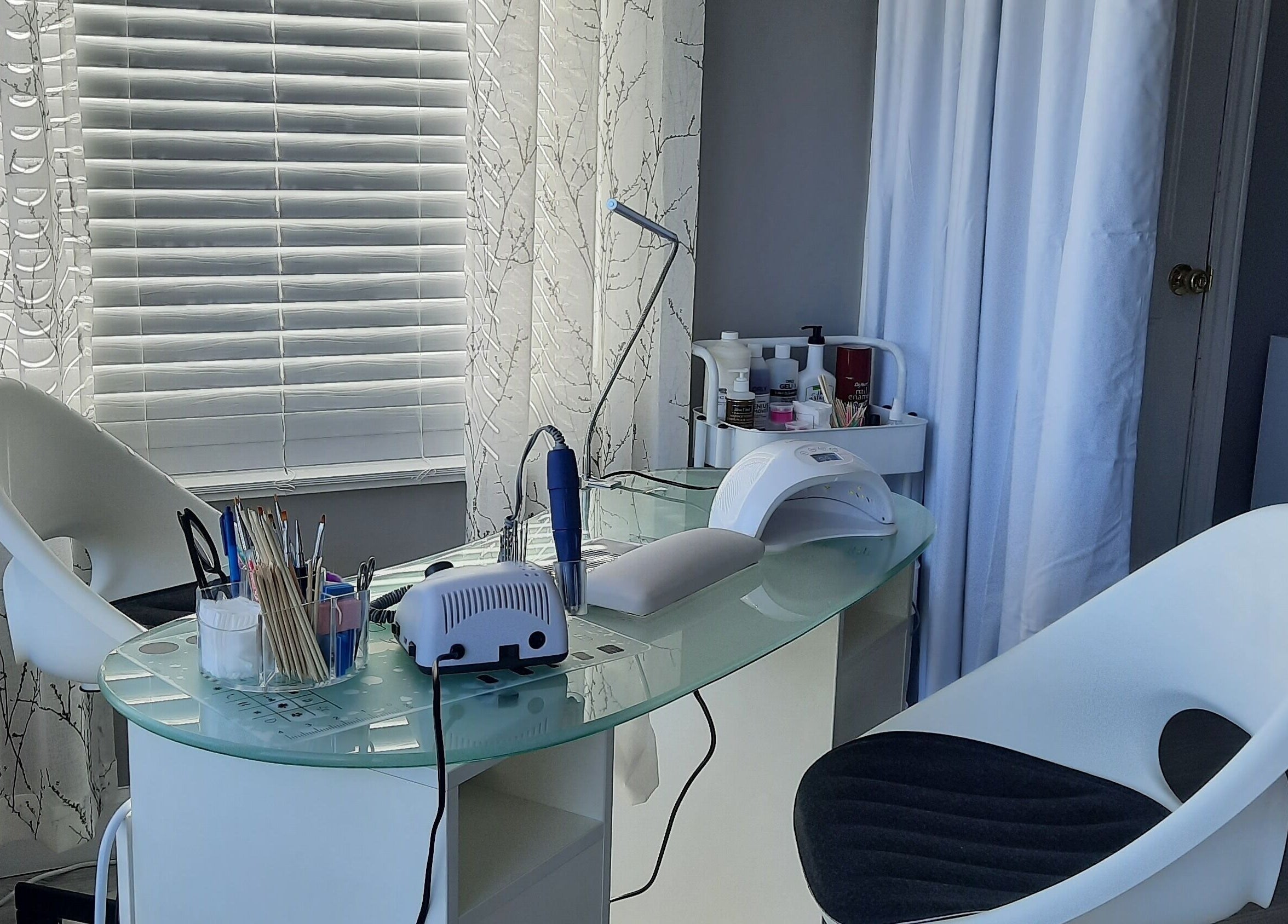 Modern nail station at Tree Treat Spa, Kawartha Lakes, Ontario, CA, featuring sleek design and professional tools.