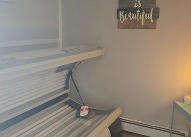 Relaxing tanning room at Tree Treat Spa, Kawartha Lakes, Ontario, CA with cozy lighting and modern sunbed.