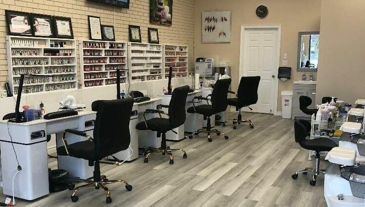 Elegant manicure stations at MyLinh Nails and Spa in Chatham-Kent, Ontario, CA, showcasing nail polish collection.