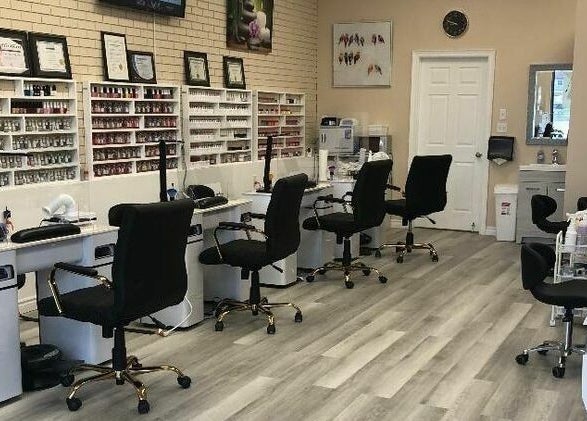 Elegant manicure stations at MyLinh Nails and Spa in Chatham-Kent, Ontario, CA, showcasing nail polish collection.