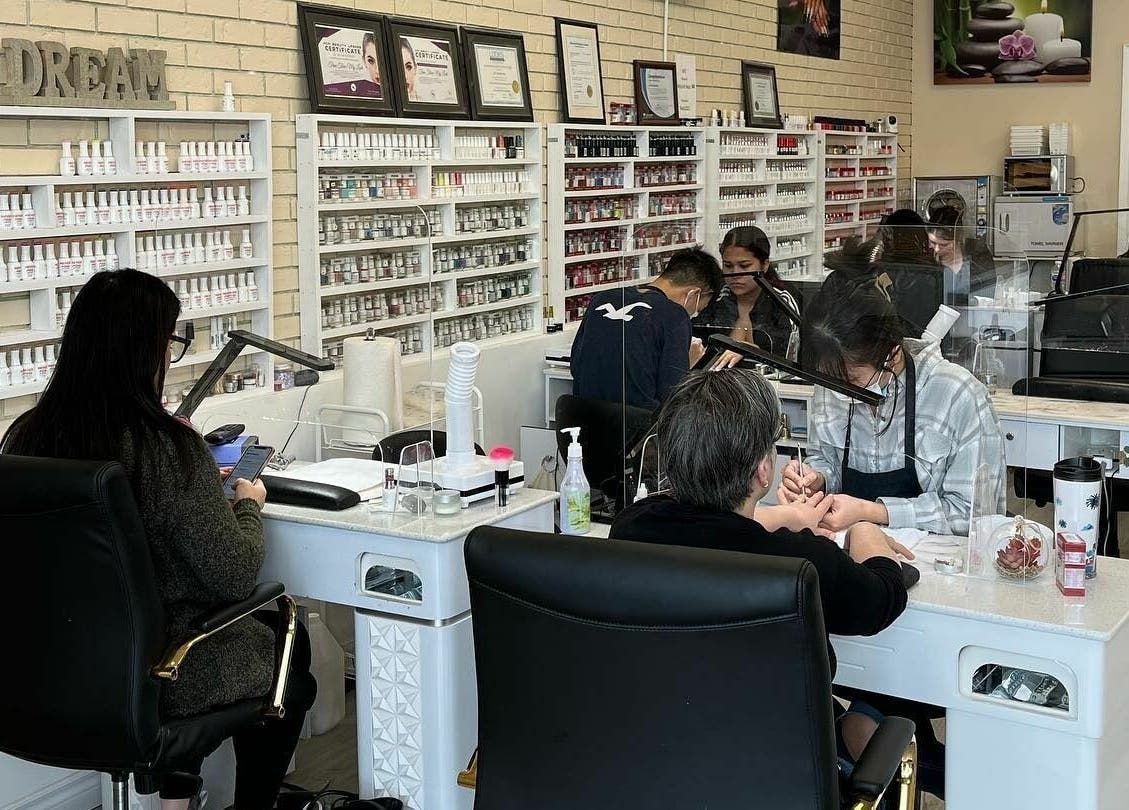Professionals at MyLinh Nails and Spa, Chatham-Kent, ON, perfecting nail care amidst tranquil ambiance.