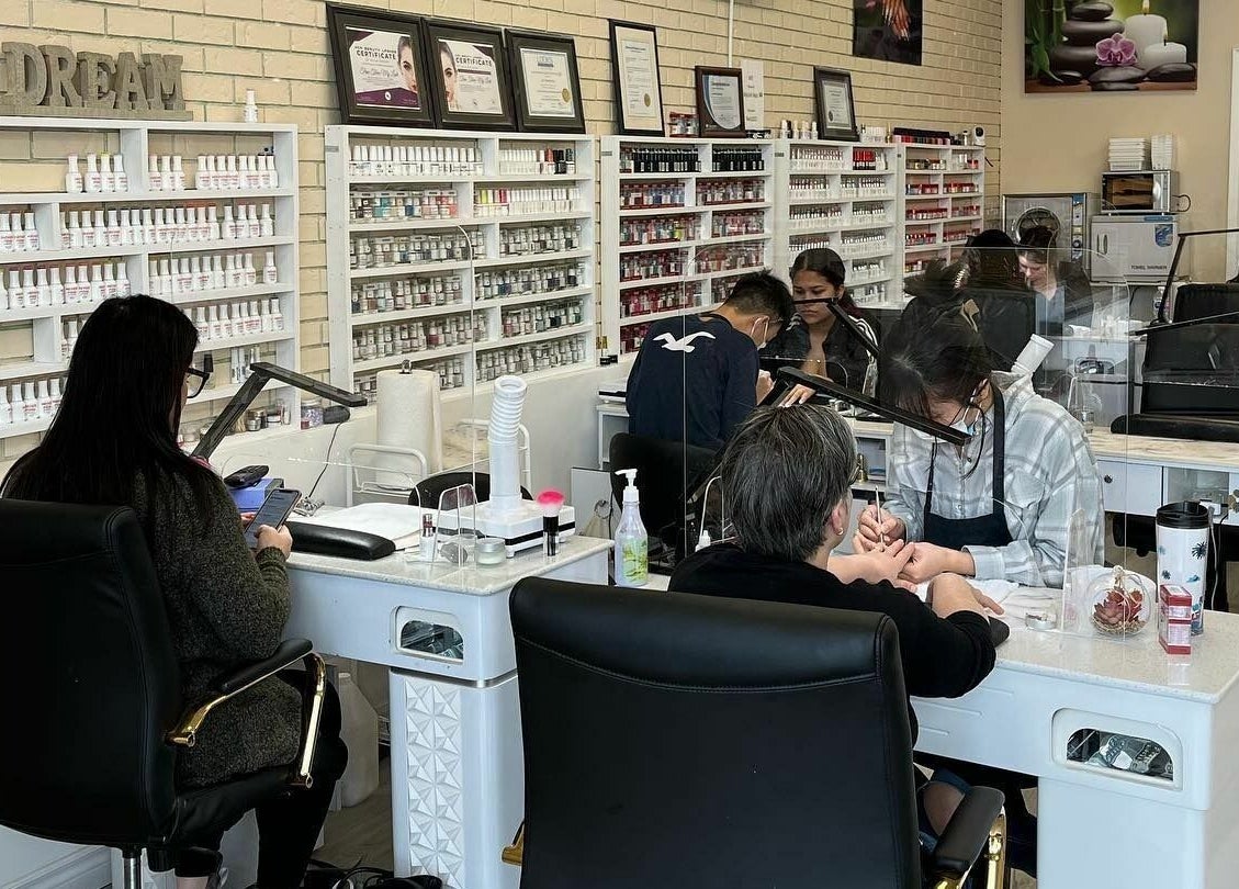 Professionals at MyLinh Nails and Spa, Chatham-Kent, ON, perfecting nail care amidst tranquil ambiance.