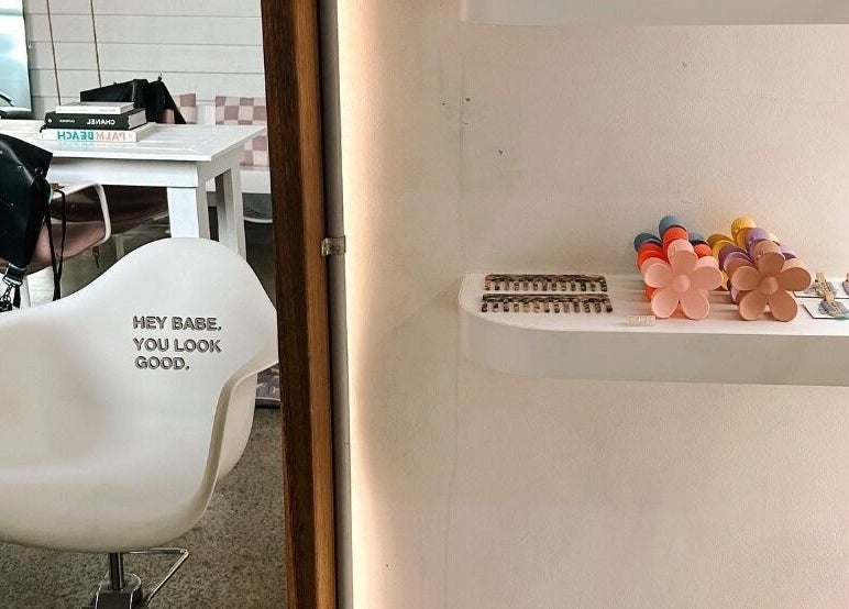 Modern salon chair and chic decor at Rinsd Hair in Palm Beach, Queensland, AU, showcasing inviting ambiance.