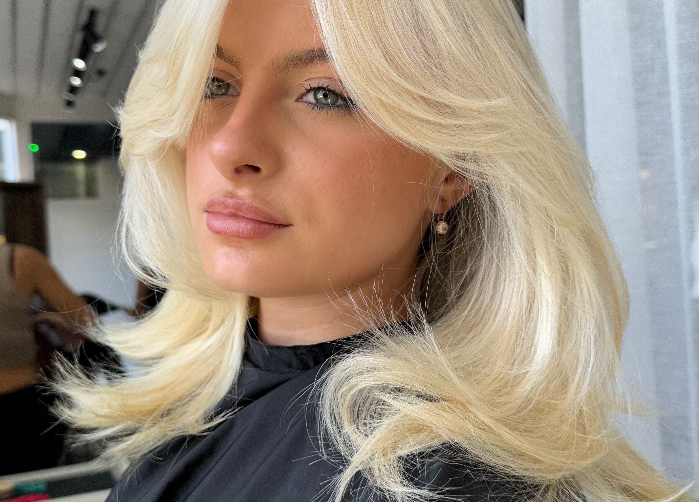 Blonde hairstyle at Rinsd Hair, Palm Beach, Queensland, AU, showcasing sleek salon results.