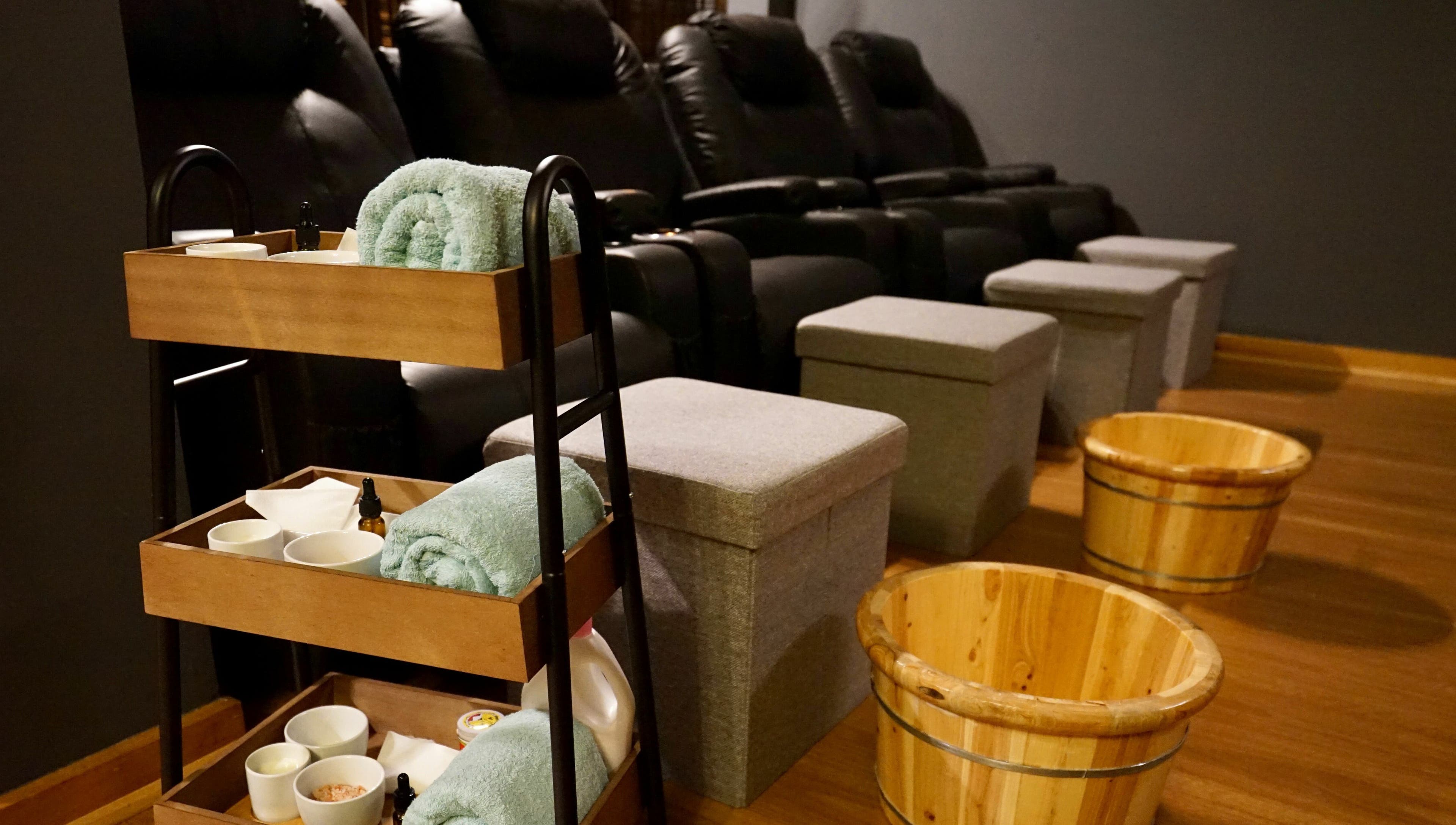 Relaxing foot spa setup at Oceanic Spa Moonah, Moonah, Tasmania, AU with towels and wooden buckets.