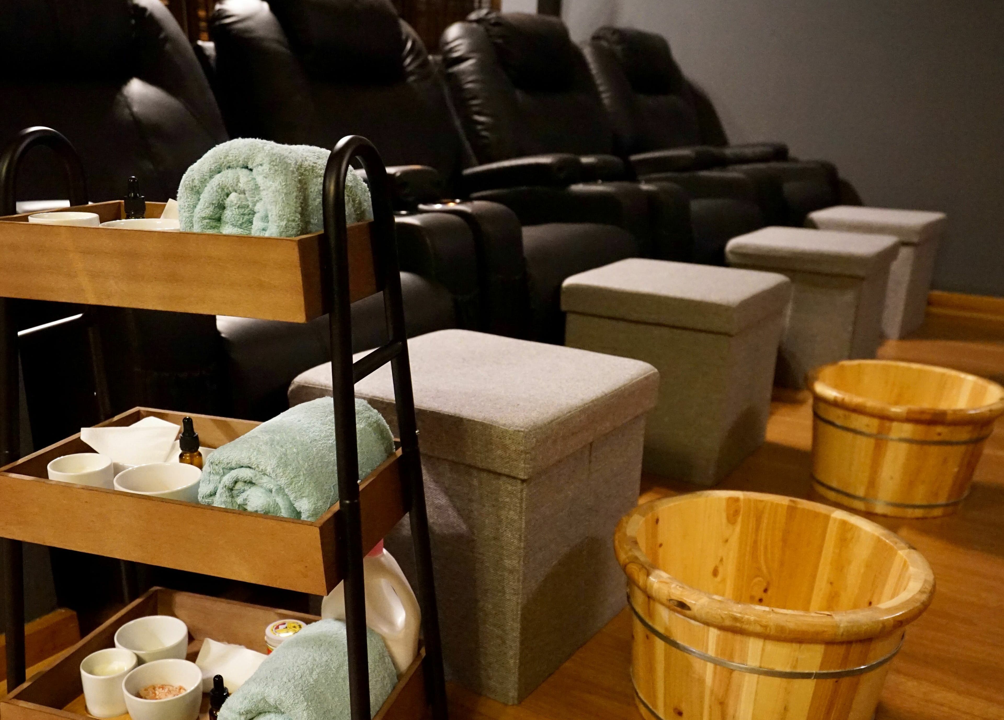 Relaxing foot spa setup at Oceanic Spa Moonah, Moonah, Tasmania, AU with towels and wooden buckets.