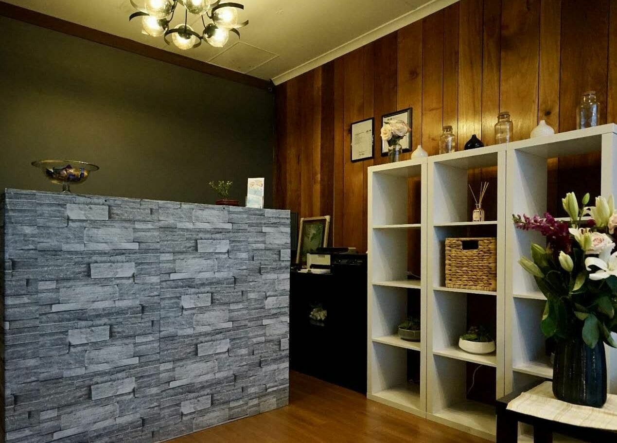 Reception area at Oceanic Spa Moonah with elegant decor and floral arrangements in Moonah, Tasmania, AU.