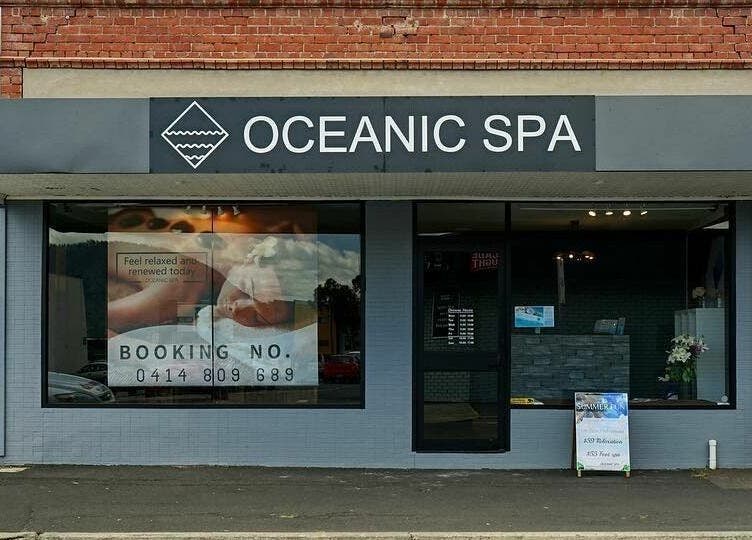 Front view of Oceanic Spa Moonah in Moonah, Tasmania, AU with booking details displayed in the window.