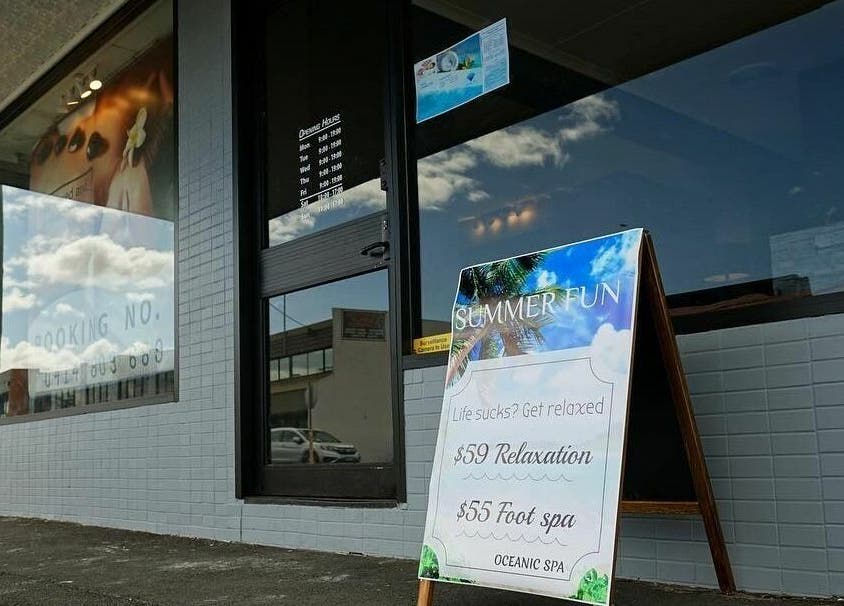 Front view of Oceanic Spa Moonah in Moonah, Tasmania, AU with promotional sign for relaxation services.