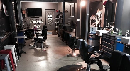 Cozy interior of The Barbers Bru in Albury, New South Wales, AU showcasing vintage barber chairs and stylish decor.
