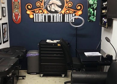 Tattoo studio interior at The Barbers Bru, Albury, New South Wales, AU, featuring art and tattoo equipment.