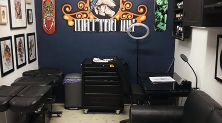 Tattoo studio interior at The Barbers Bru, Albury, New South Wales, AU, featuring art and tattoo equipment.