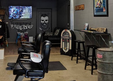 Chic interior of The Barbers Bru, Albury, New South Wales, AU with black chairs and vintage decor.