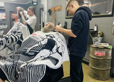 Barbers styling hair at The Barbers Bru, a trendy spot in Albury, New South Wales, AU.