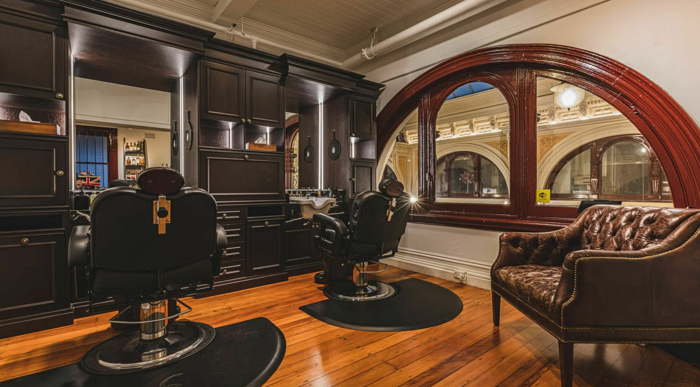 Luxurious barbershop interior at Truefitt and Hill Melbourne, styled with leather chairs in Melbourne, Victoria, AU.
