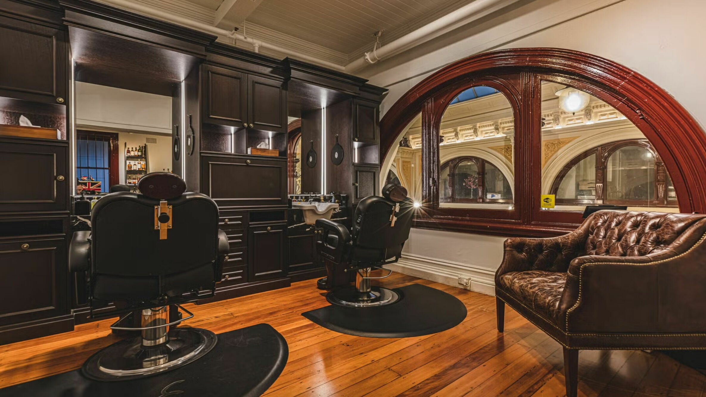 Luxurious barbershop interior at Truefitt and Hill Melbourne, styled with leather chairs in Melbourne, Victoria, AU.