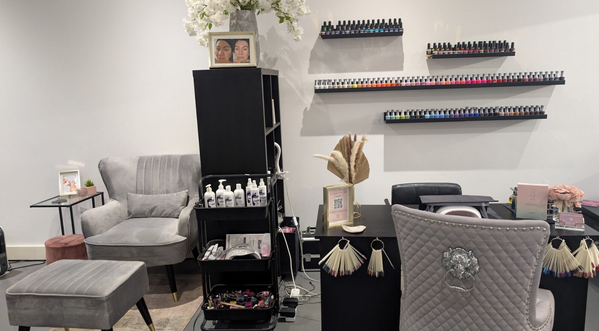 Cozy salon corner at The Mill Retreat Hair & Beauty, Huddersfield, England, GB, with nail polish display.