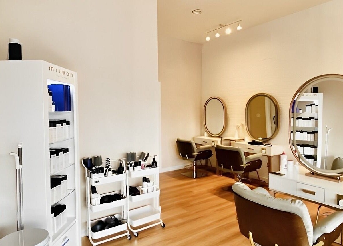 Modern salon interior at Soulo Hair Spa Chinatown, Las Vegas, Nevada, US showcasing elegant mirrors and styling chairs.