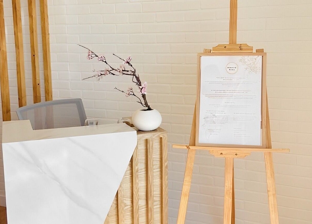 Reception area of Soulo Hair Spa Chinatown in Las Vegas, Nevada, US with modern decor and floral arrangement.