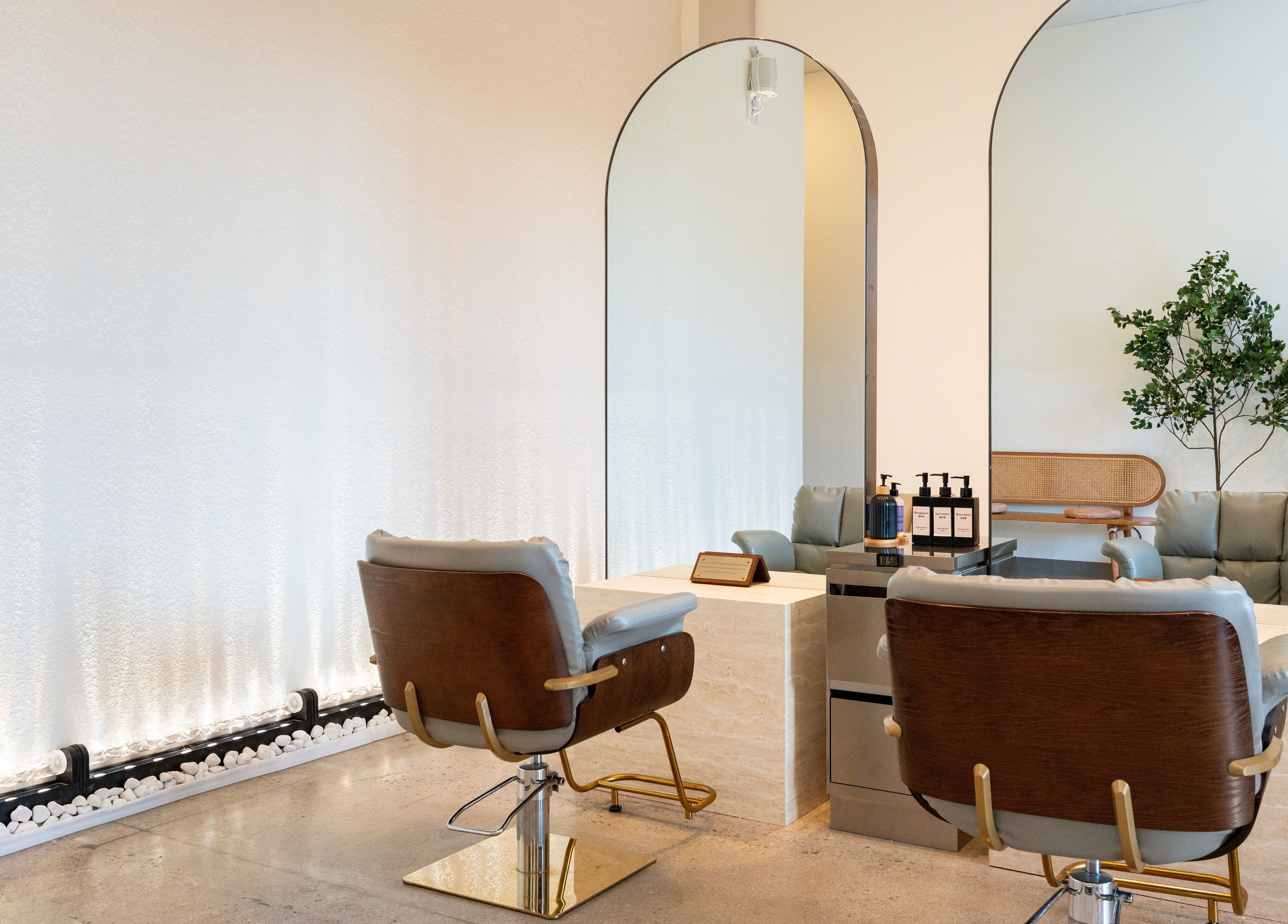 Interior of Soulo Hair Spa Southwest with plush chairs and modern mirrors in Las Vegas, Nevada, US.