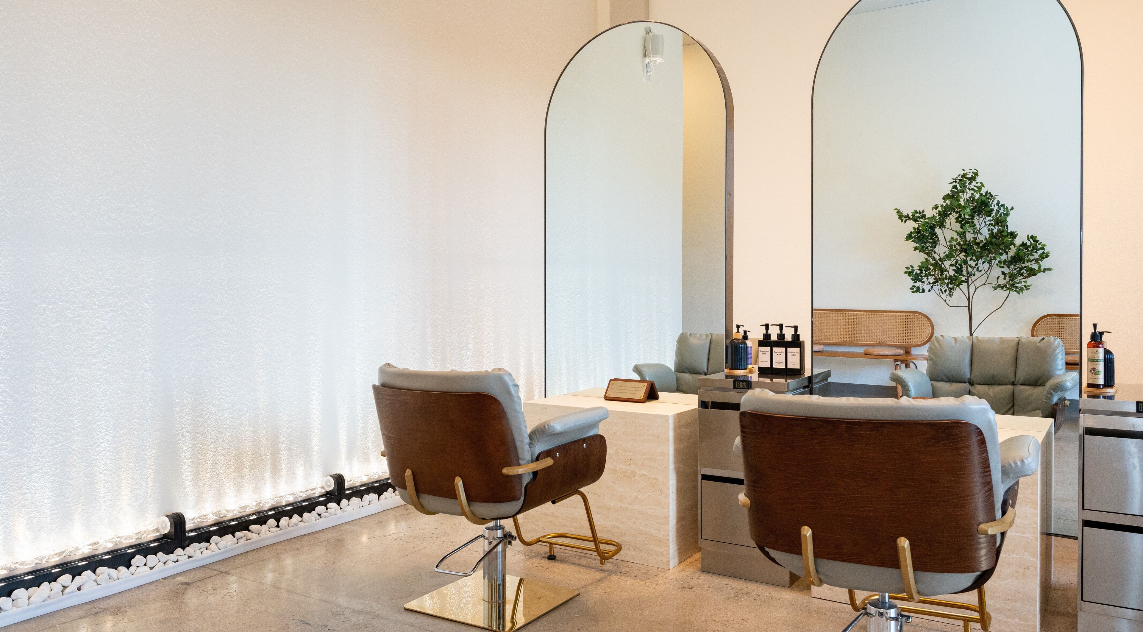 Interior of Soulo Hair Spa Southwest with plush chairs and modern mirrors in Las Vegas, Nevada, US.