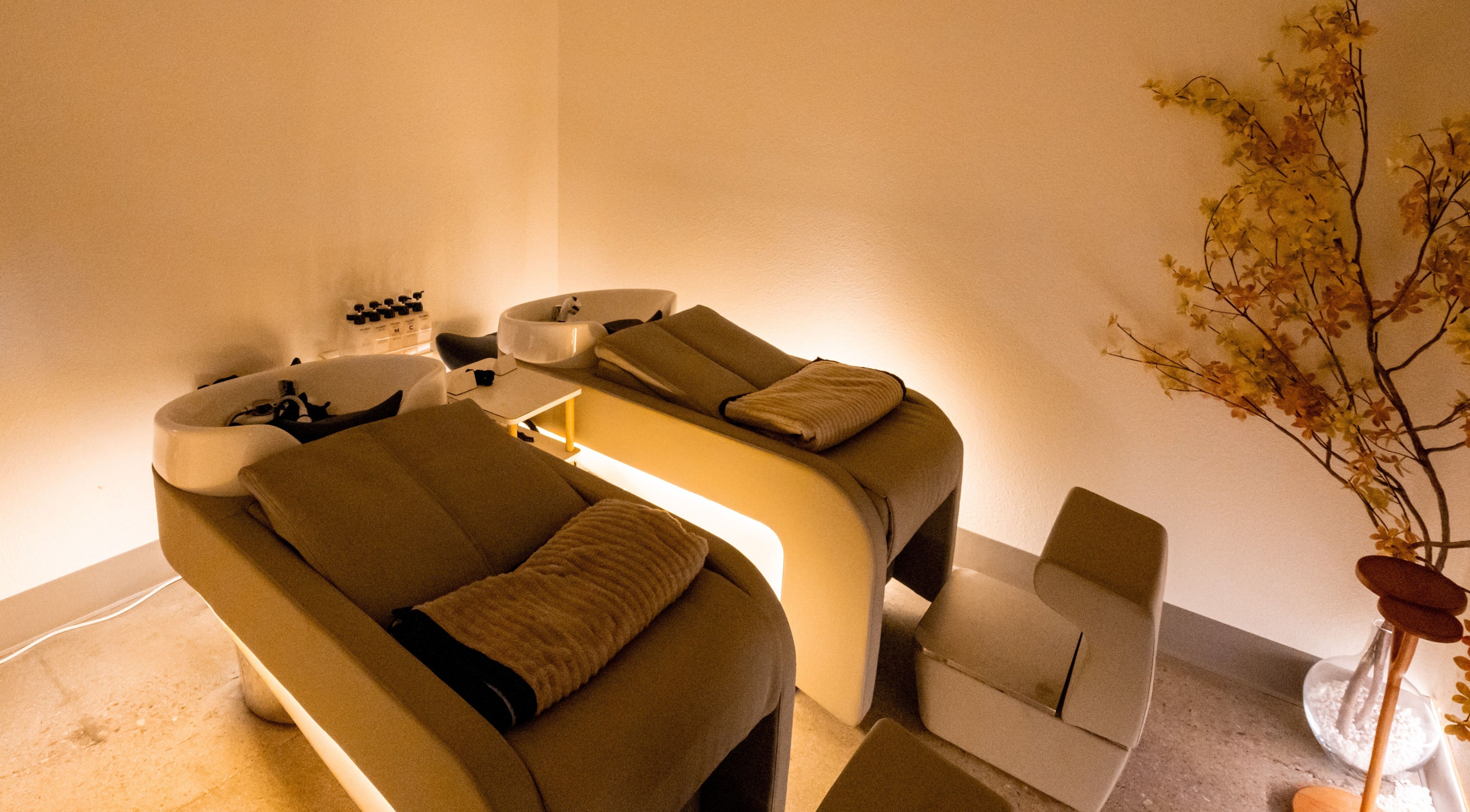 Relaxing hair washing stations at Soulo Hair Spa Southwest, Las Vegas, Nevada, US with cozy ambient lighting.