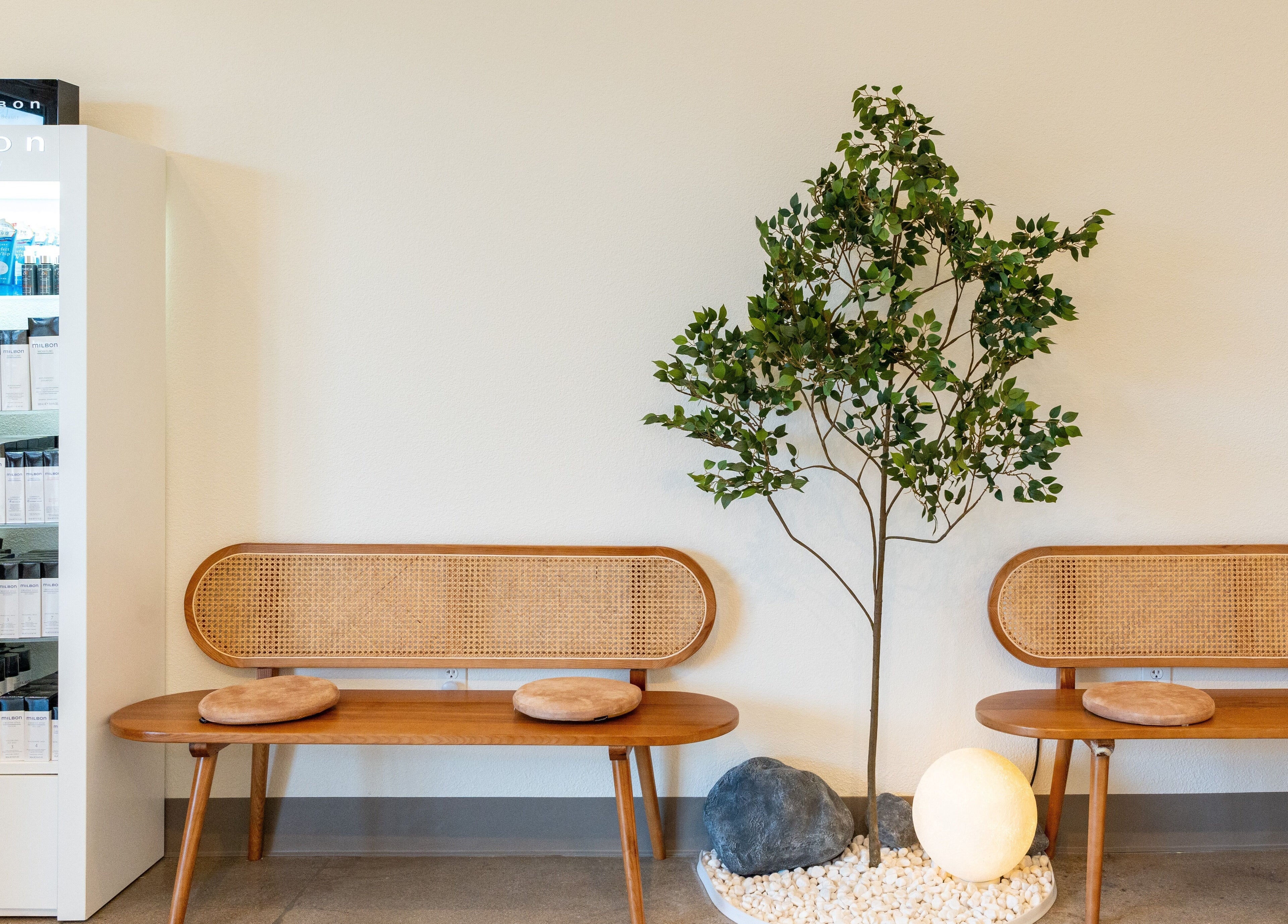 Calming seating area at Soulo Hair Spa Southwest, Las Vegas, Nevada, US with chic benches and decor.