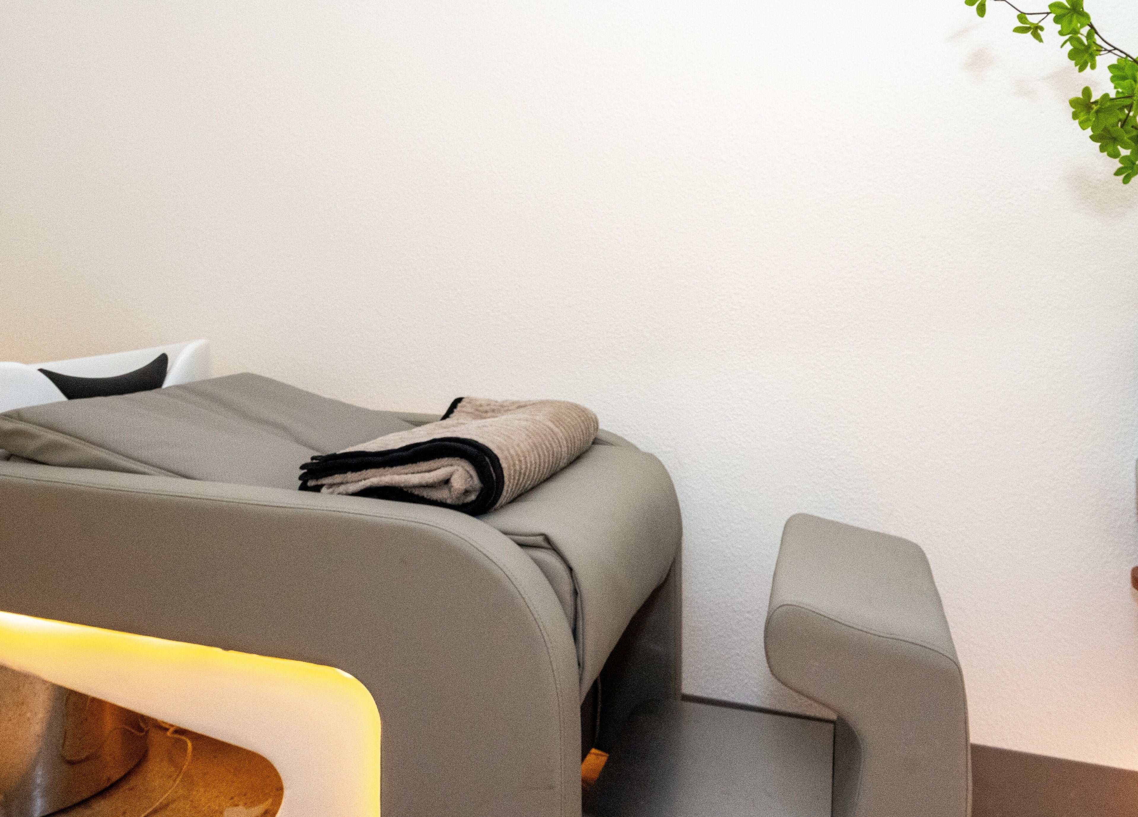 Comfortable hair washing station at Soulo Hair Spa Southwest in Las Vegas, Nevada, US, with green decor.