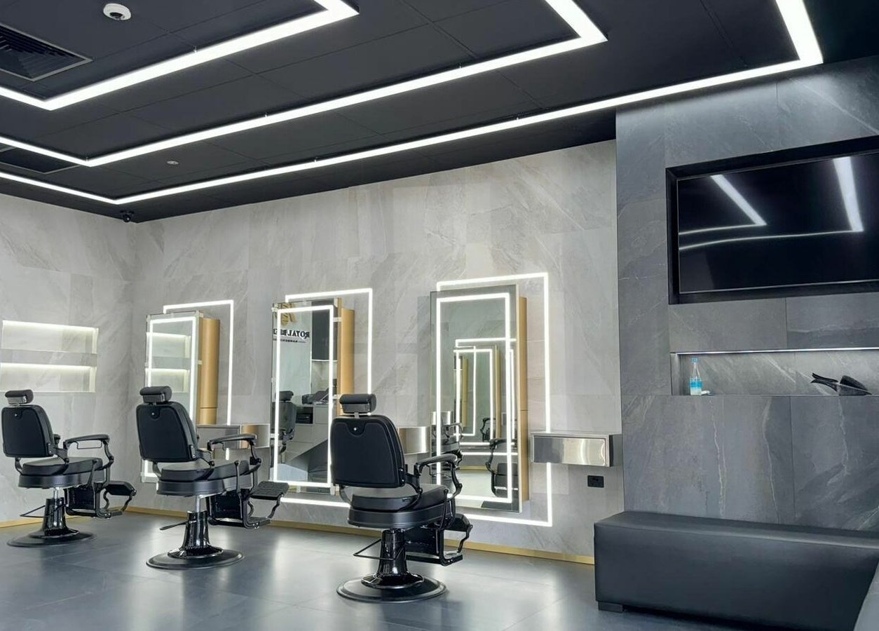 Modern interior of Royal Blends - Gregory Hills, Gledswood Hills, New South Wales, AU with stylish barber chairs.