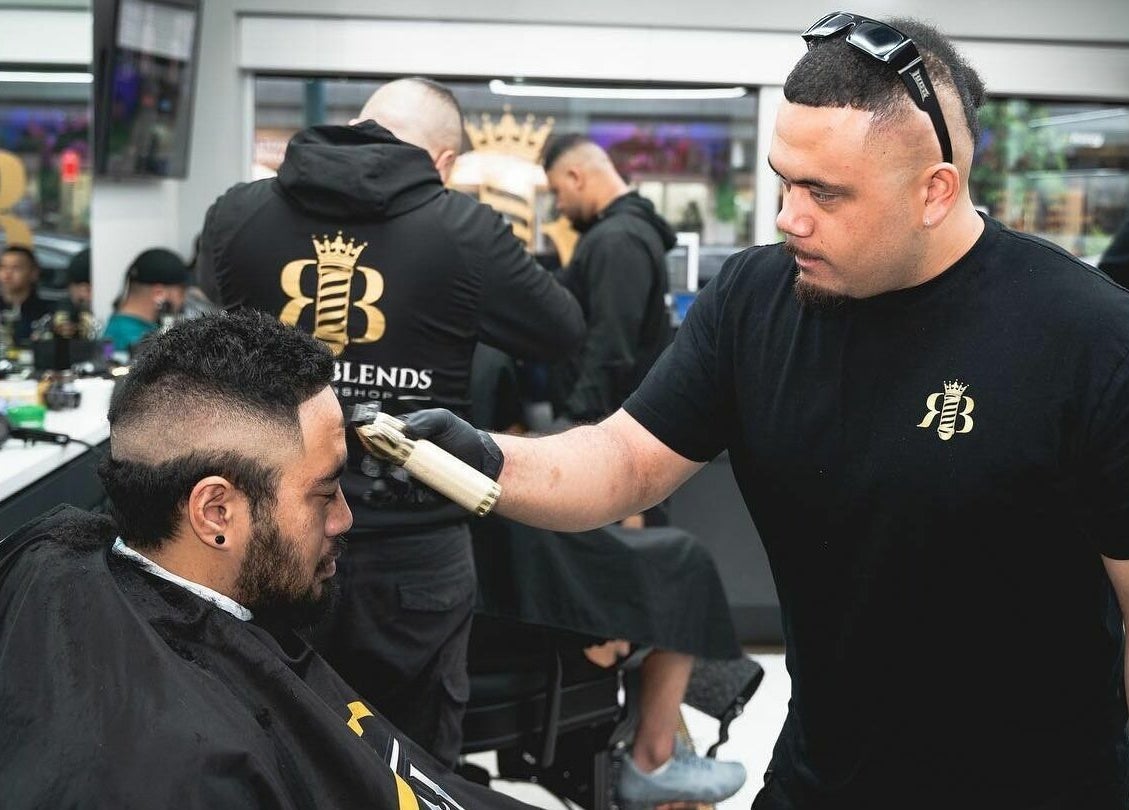 Expert barber at Royal Blends - Gregory Hills located in Gledswood Hills, New South Wales, AU crafting a stylish haircut.