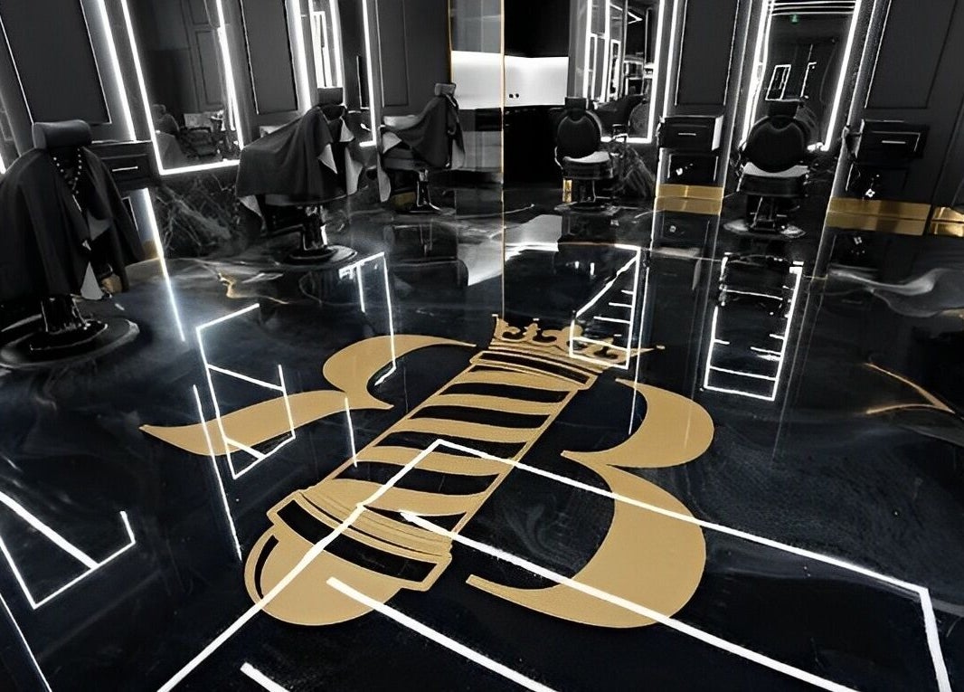 Modern interior of Royal Blends Barbershop Warwick Farm, New South Wales, AU with sleek black and gold design.