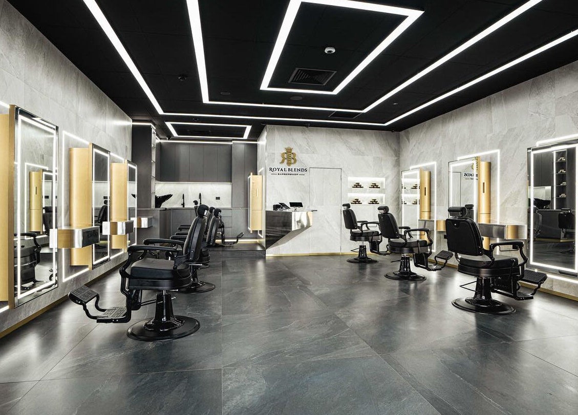 Sophisticated interior of Royal Blends - Casula, in Casula, New South Wales, AU with modern barber chairs.