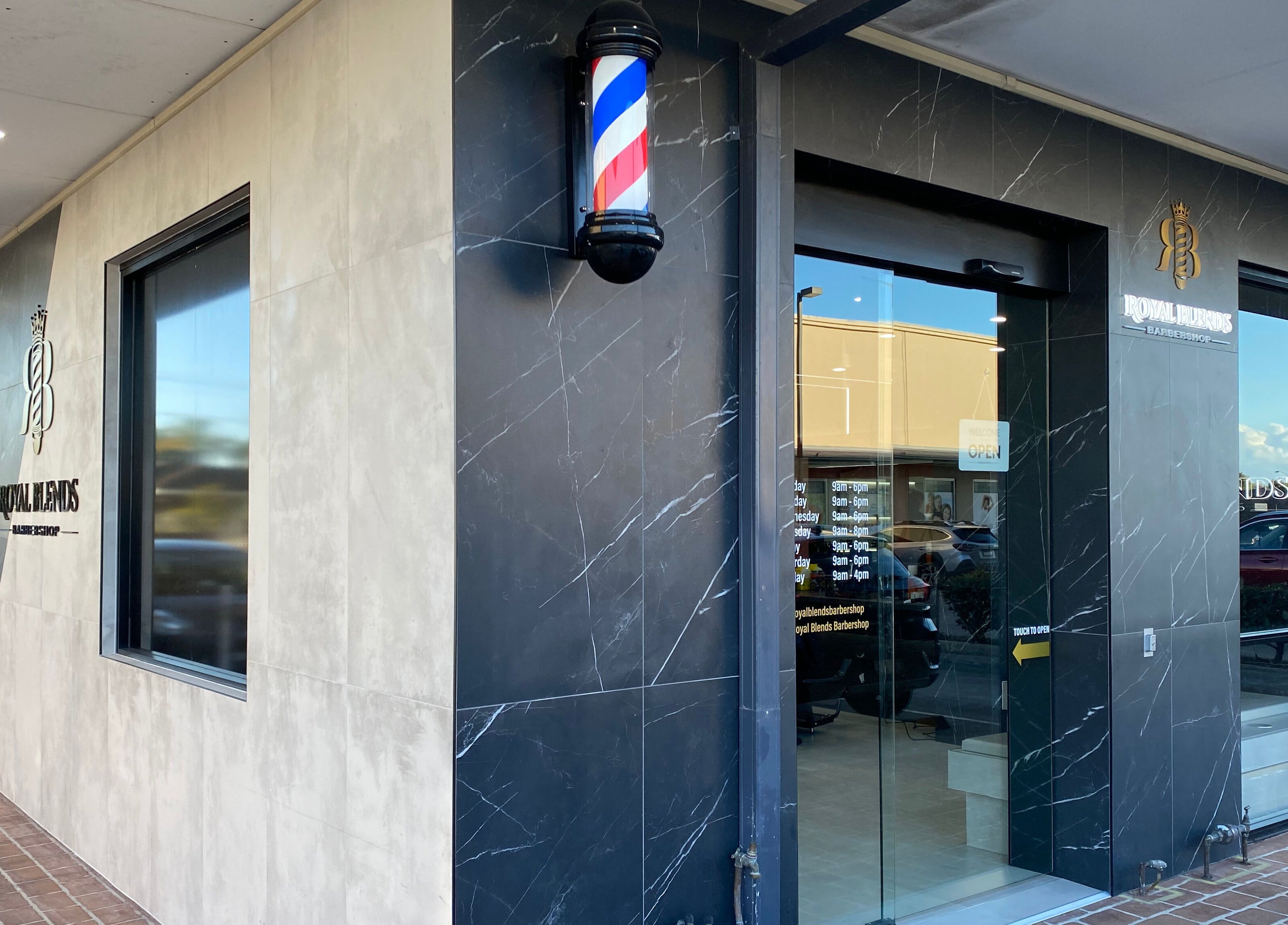 Front view of Royal Blends - Casula, showcasing modern black marble exterior in Casula, New South Wales, AU.