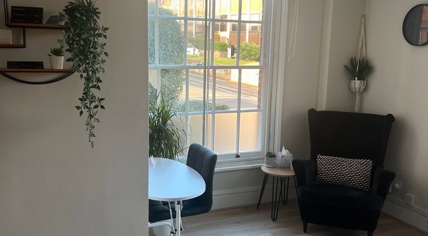 Cozy seating and greenery at Victoria Alice Brows, Newbury, England, GB, offering a tranquil beauty experience.