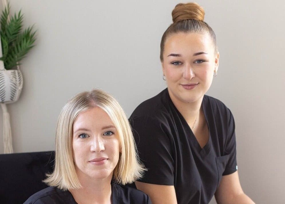 Two staff members at Victoria Alice Brows, Newbury, England, GB, smiling in professional setting.