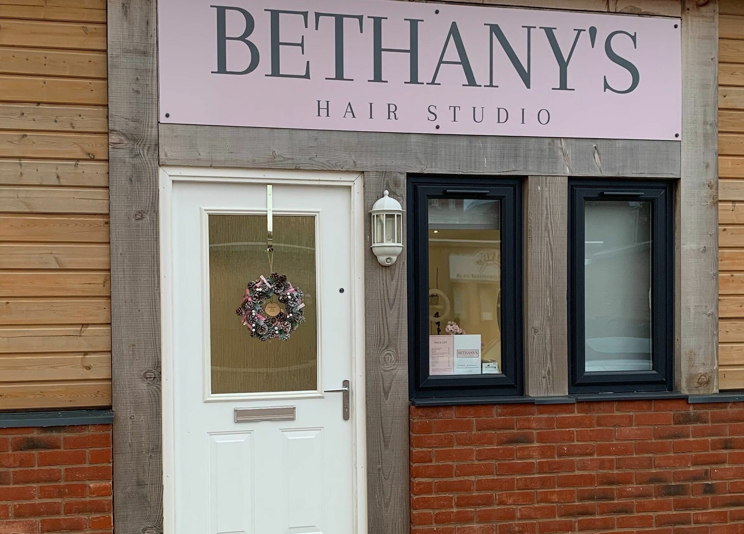 Entrance of Bethany’s Hair Studio in Dudley, England, GB with a welcoming wreath on the door.