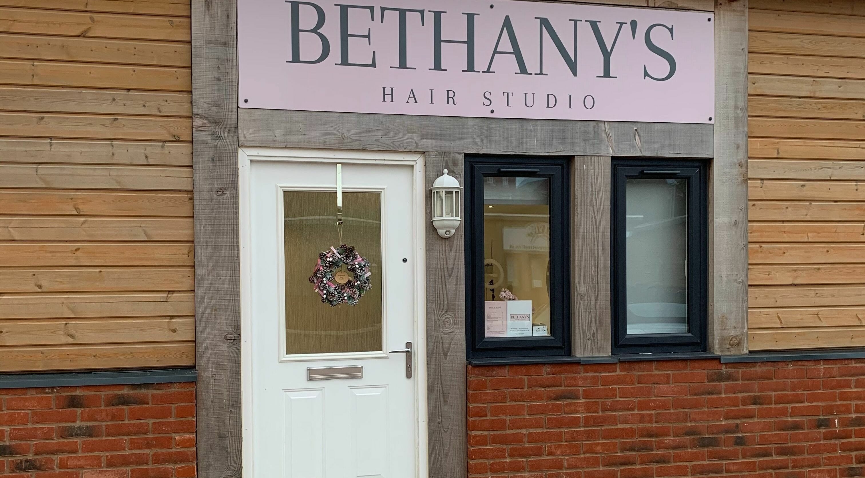Entrance of Bethany’s Hair Studio in Dudley, England, GB with a welcoming wreath on the door.