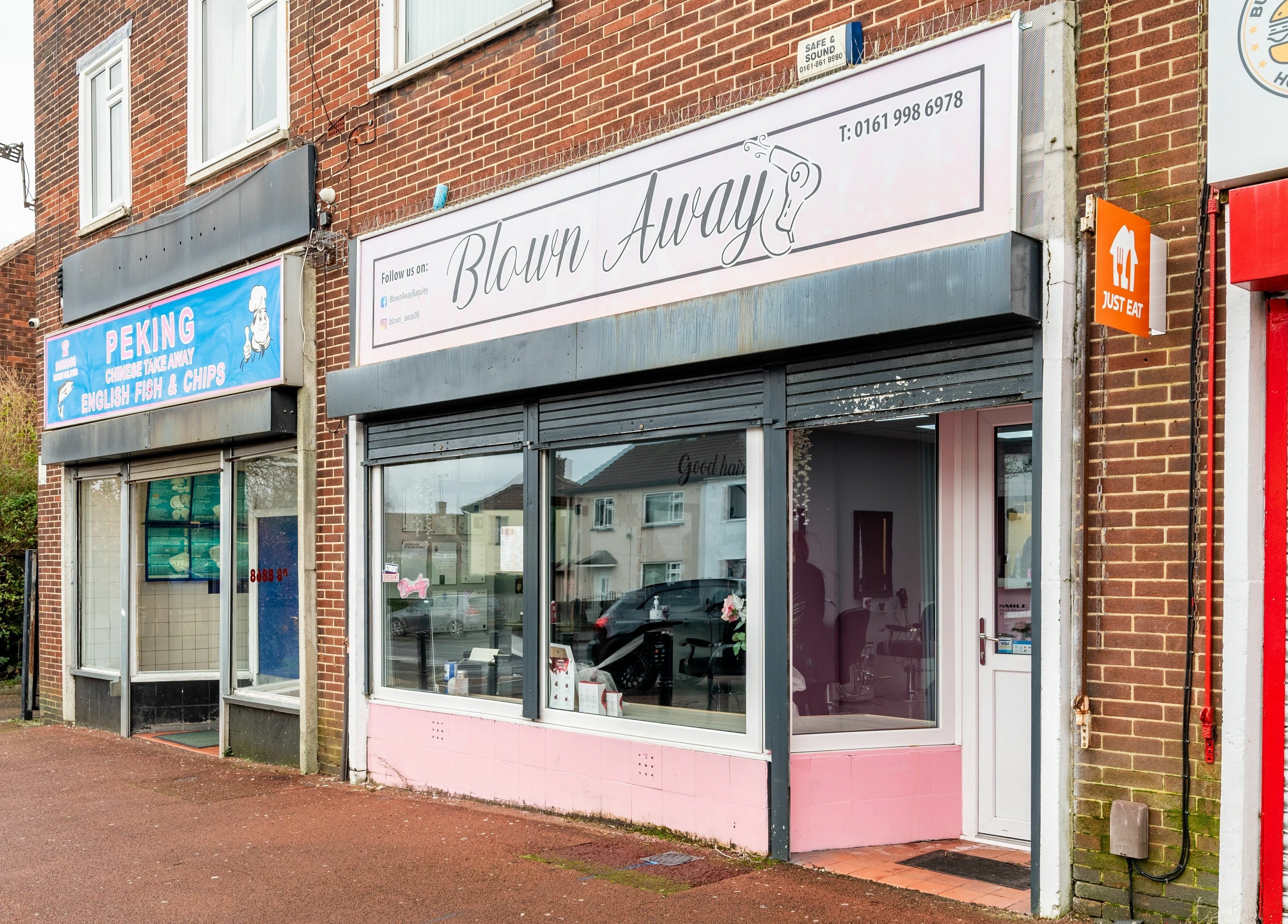 Blown Away salon exterior in Wythenshawe, England, GB showcasing modern design.