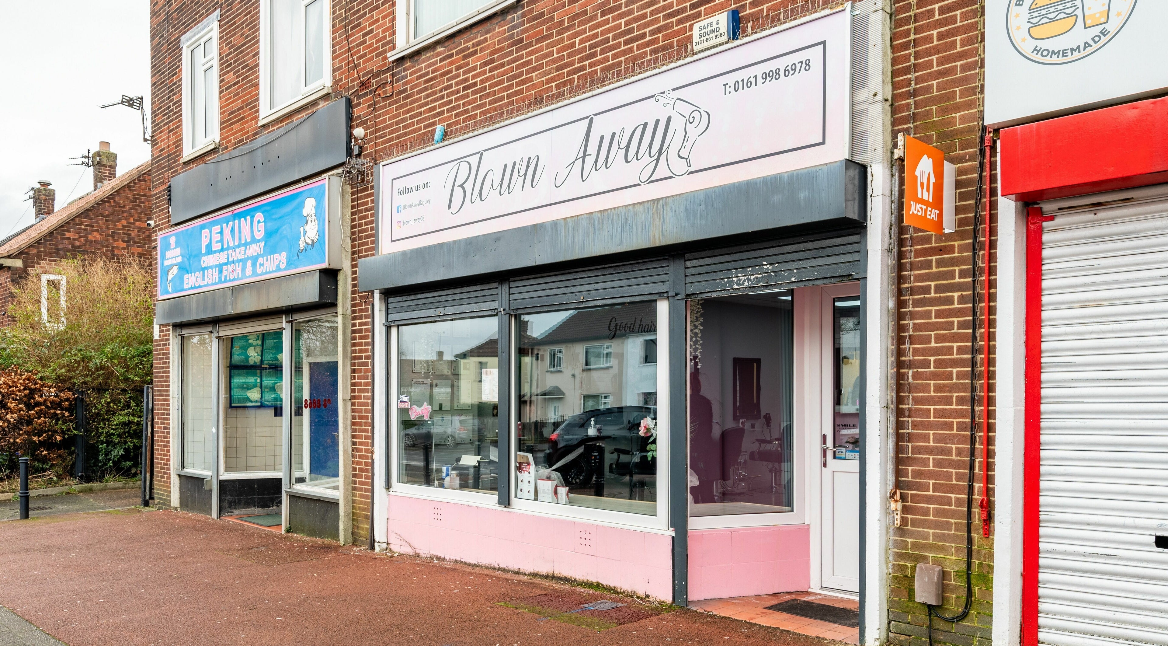 Blown Away salon exterior in Wythenshawe, England, GB showcasing modern design.