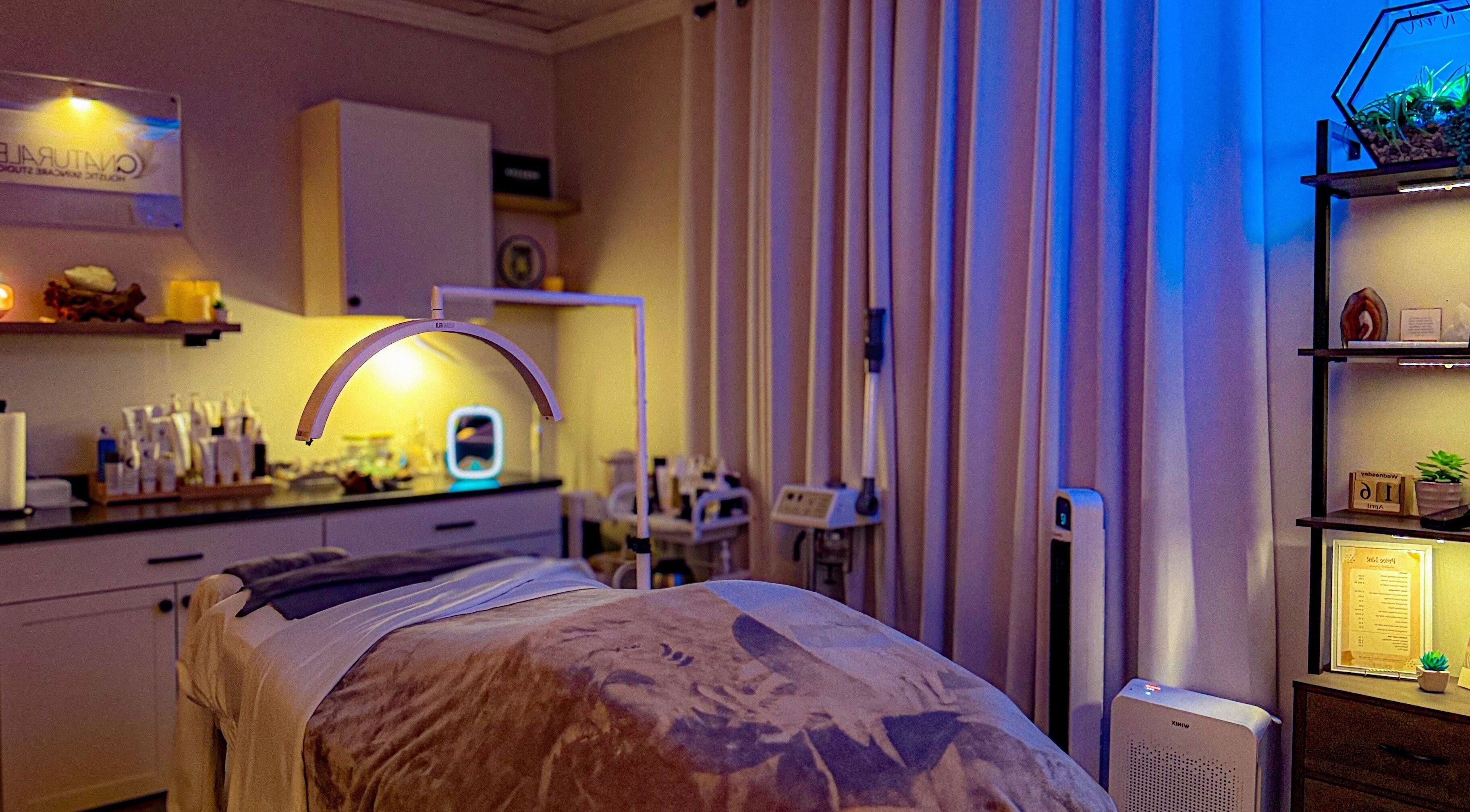 Relaxing treatment room at ANATURALE HOLISTIC SKINCARE STUDIO in Henrico, Virginia, US with soothing lighting.