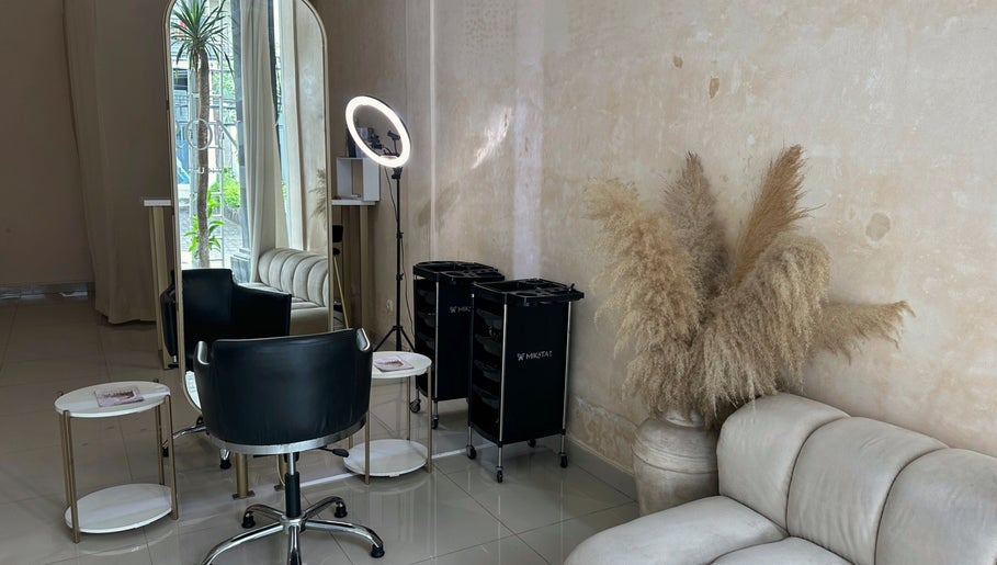 Elegant salon interior at Byron Beauty Lounge in Bali, Bali, ID with plush seating and modern styling equipment.
