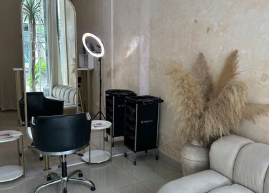Elegant salon interior at Byron Beauty Lounge in Bali, Bali, ID with plush seating and modern styling equipment.