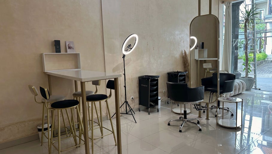 Modern interior of Byron Beauty Lounge in Bali, Bali, ID featuring chic seating and ring light.