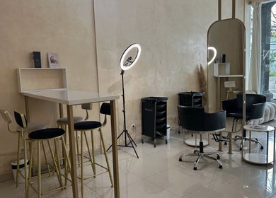 Modern interior of Byron Beauty Lounge in Bali, Bali, ID featuring chic seating and ring light.
