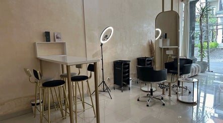 Modern interior of Byron Beauty Lounge in Bali, Bali, ID featuring chic seating and ring light.