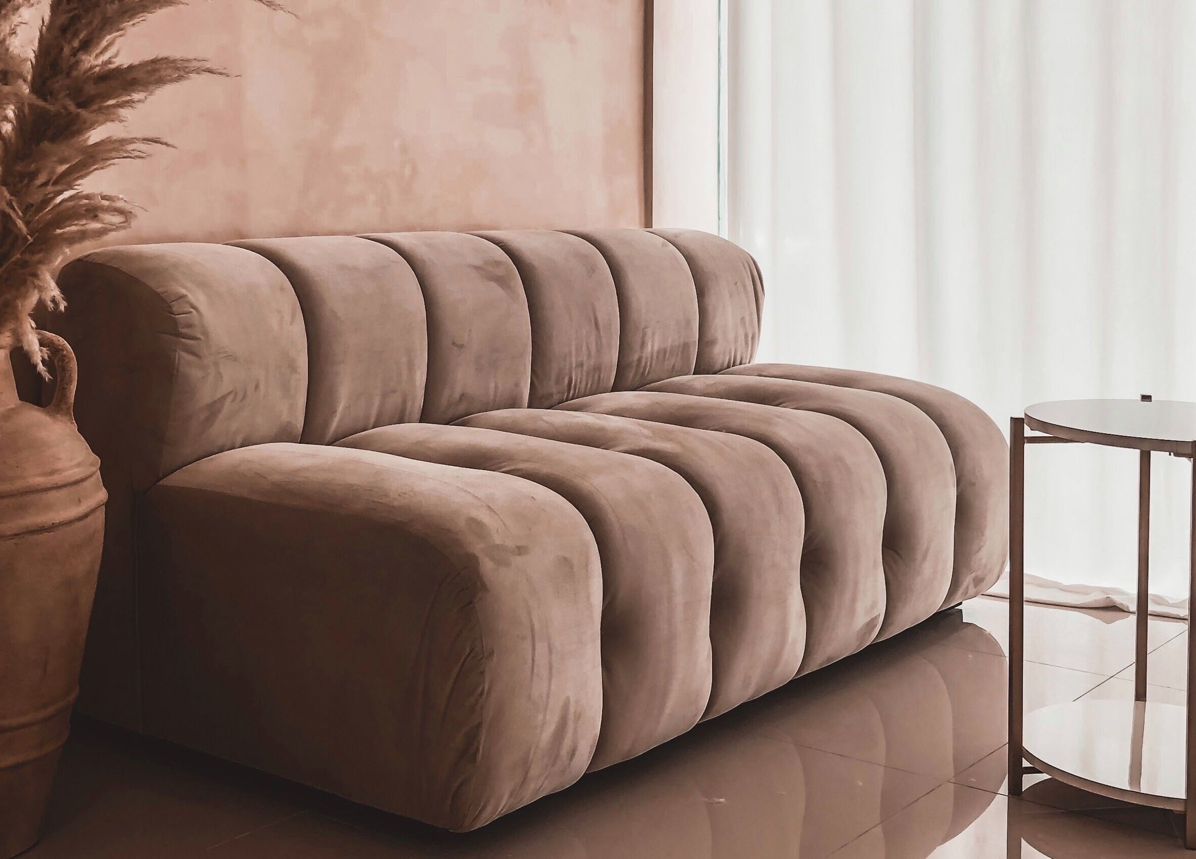 Cozy seating area at Byron Beauty Lounge in Bali, Bali, ID with plush sofa and chic decor.