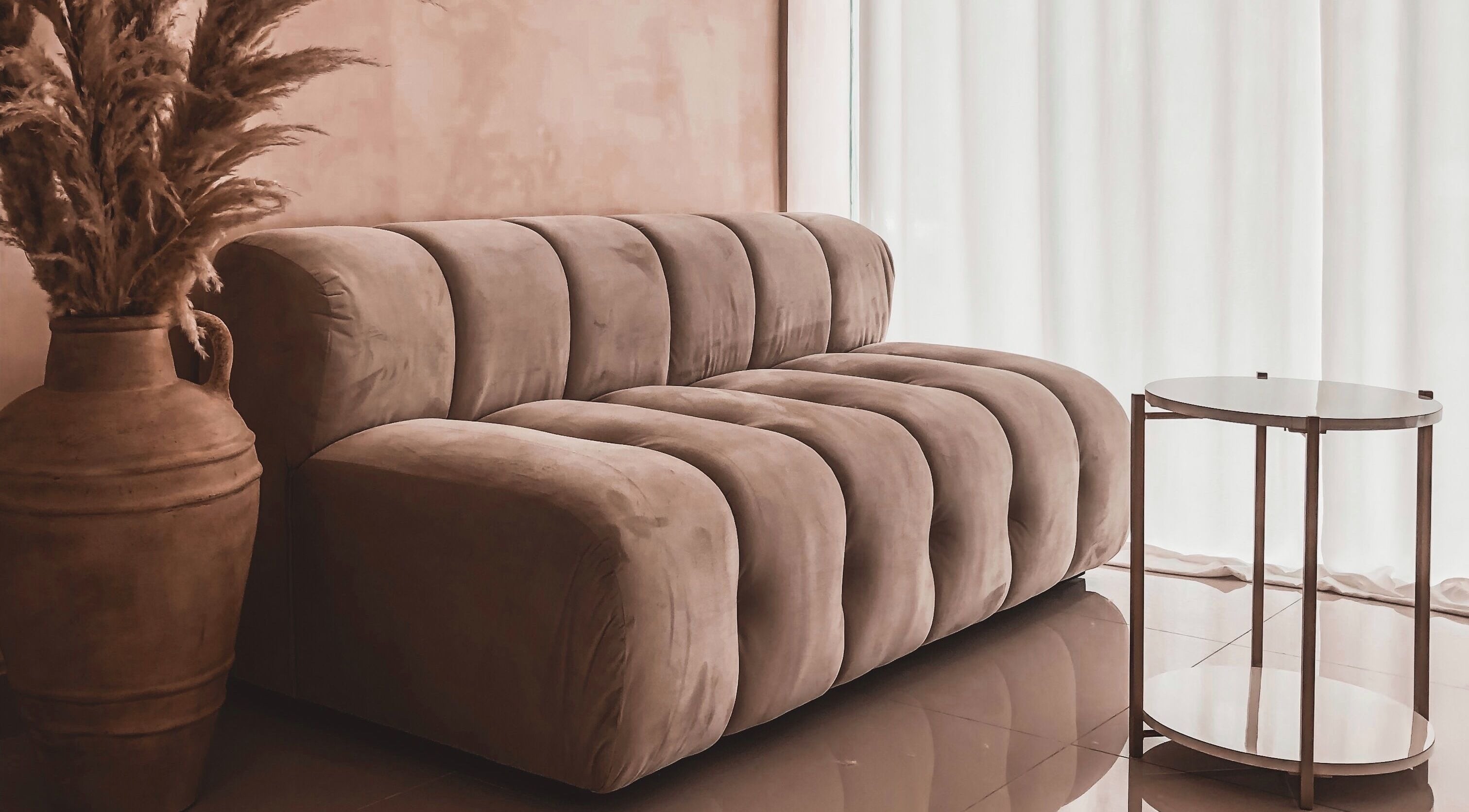 Cozy seating area at Byron Beauty Lounge in Bali, Bali, ID with plush sofa and chic decor.